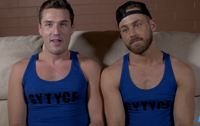 "I'm seriously not getting paid enough to wear this matching tank top and listen to this guy."