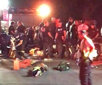 First responders crowd around victims from a mass shooting at an Orlando, Fla.. (photo credit - NYDaily News)